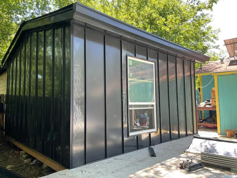 Black standing seam metal wall panels for Metal Roof Installation in Patterson